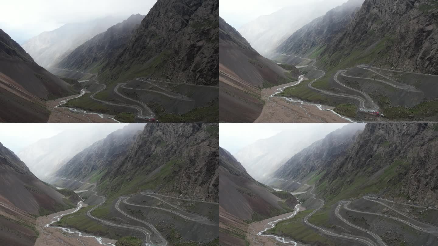 航拍新疆独库公路峡谷盘山路车流画面