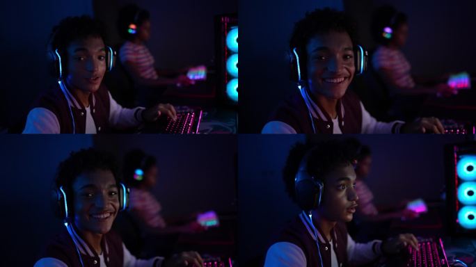 一个十几岁的男孩在家玩电脑的肖像