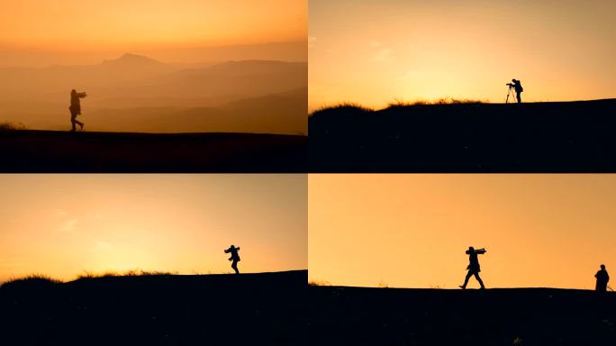 孤独的摄影人走在黄昏的山顶上