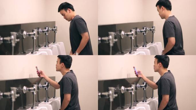 男子在洗手间使用手机