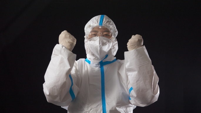 医护核酸工作人员胜利加油手势穿防护服