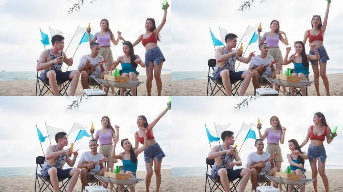 一群亚洲年轻男女在海滩上聚会。迷人的快乐朋友旅行者在海边露营时唱歌跳舞，享受热带海岛的假日度假之旅