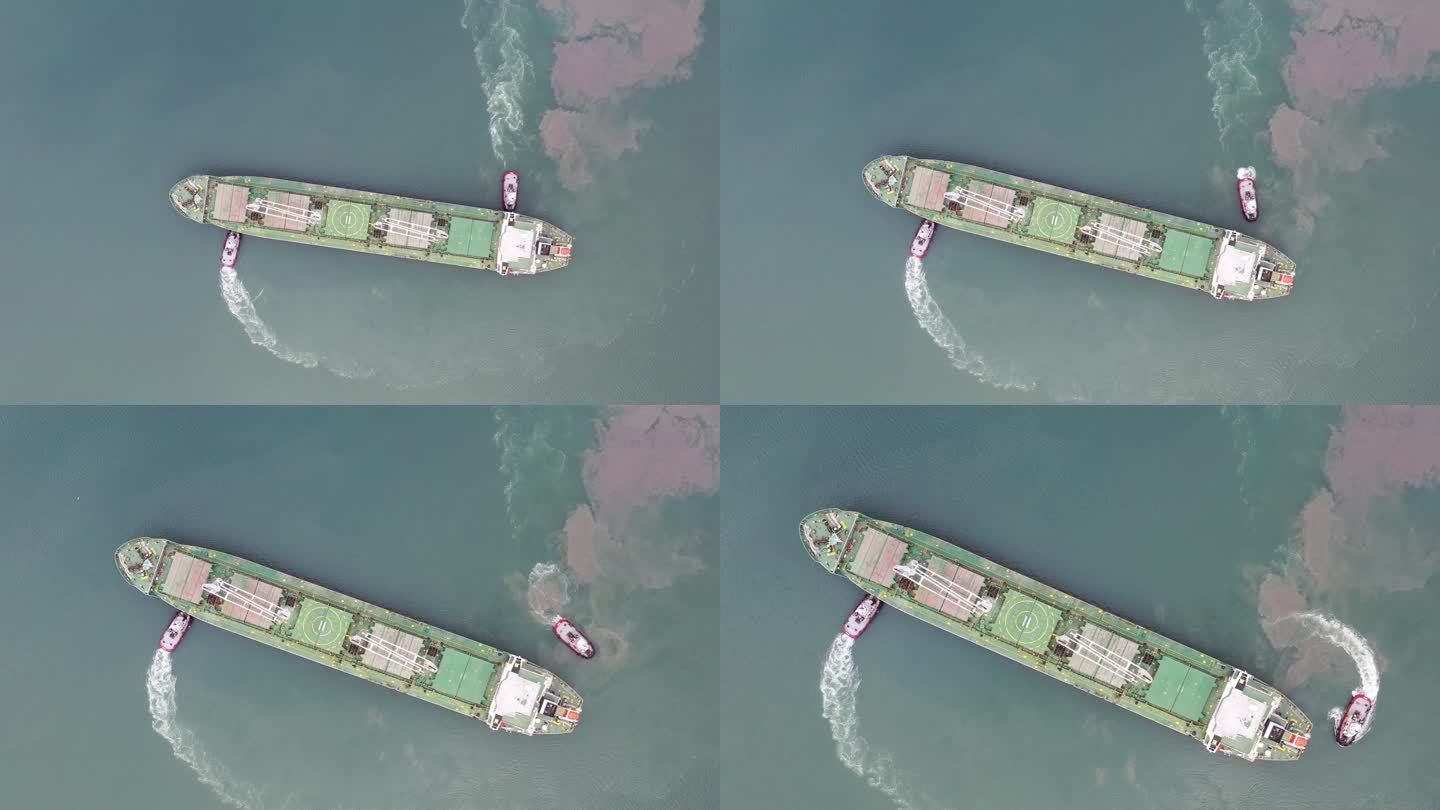 货船接近国际集装箱港的鸟瞰图。4k分辨率。