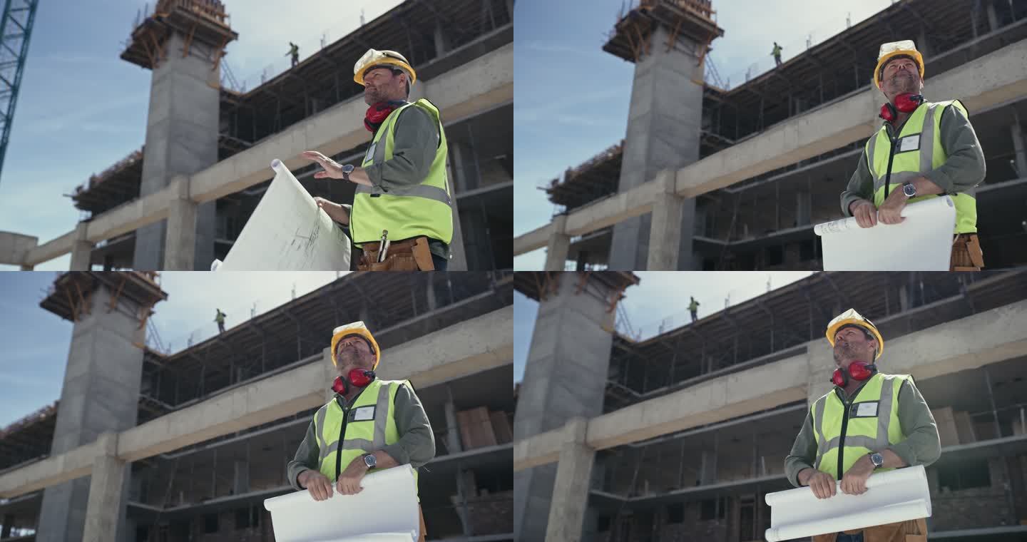 一名建筑承包商在工地上查看蓝图的4k视频片段