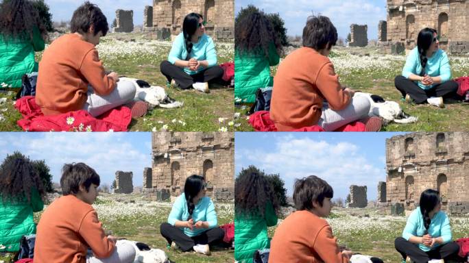 春天，多代家庭和宠物狗在古董城阿斯彭多斯度过美好时光的4K视频