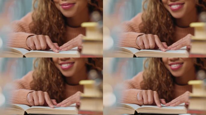 特写一名学生在图书馆或家中的书桌上阅读书页和备考时使用手指。卷发盲人或视障混血妇女用盲文阅读