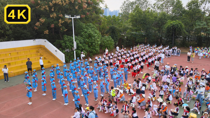 小学运动会开幕学校唱红歌舞蹈节目航拍