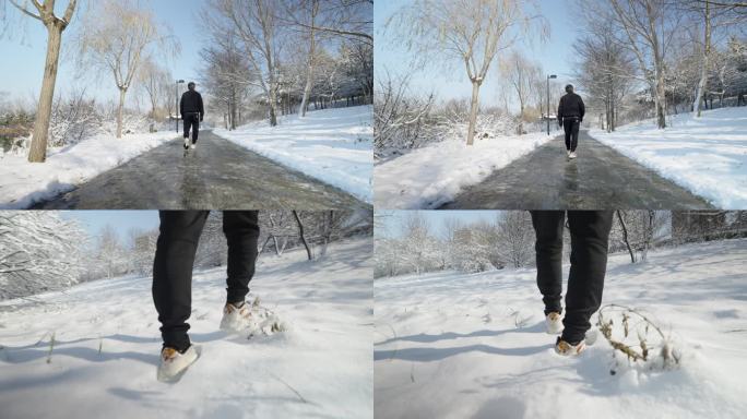 4k慢动作男子雪中小路行走前进背影特写
