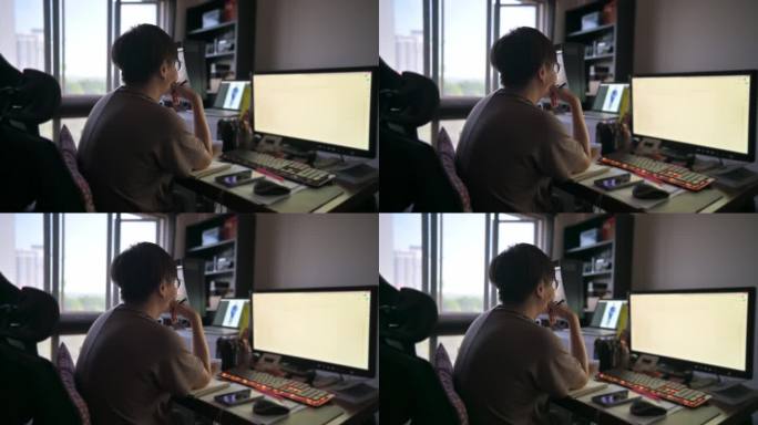 亚裔中国中年女性在家工作，使用多屏幕电子学习
