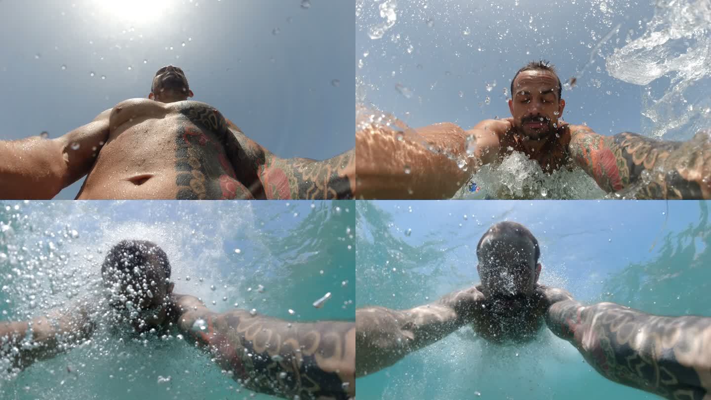 男子在海滩游泳和潜水