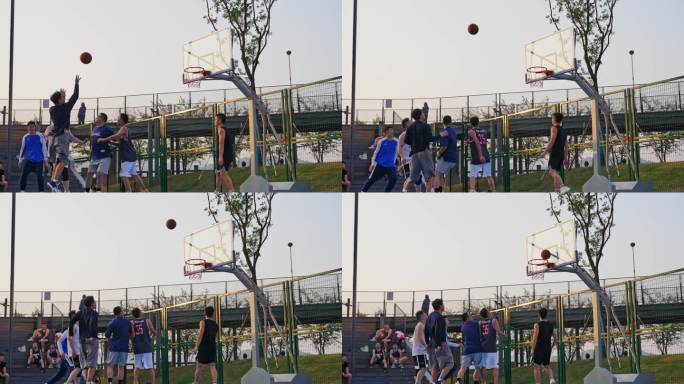 夕阳下打篮球的年轻人 户外篮球场