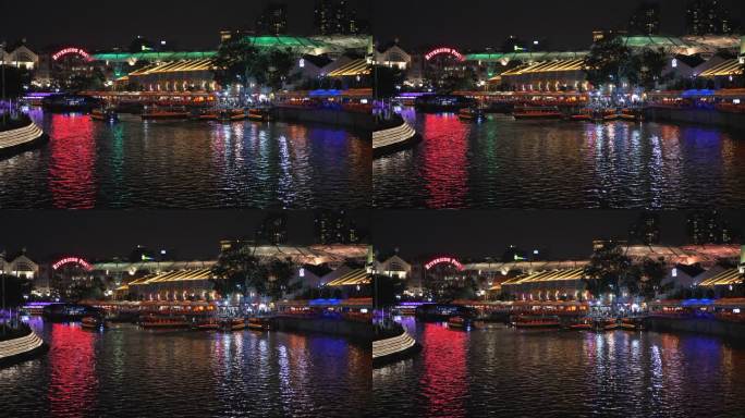 新加坡克拉克码头（Clarke Quay Jetty）上繁忙的游船和多彩的河流夜景