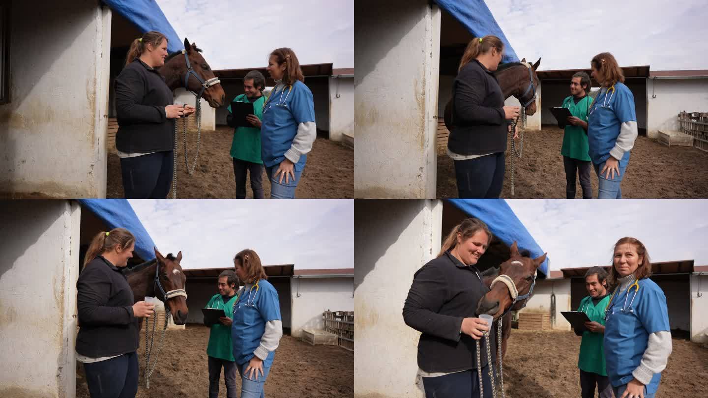 兽医和助手与马主人谈论马的维生素和营养