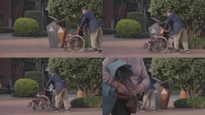 老人搀扶轮椅走路