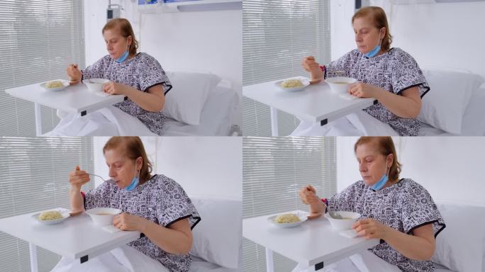 女患者在病床上用餐