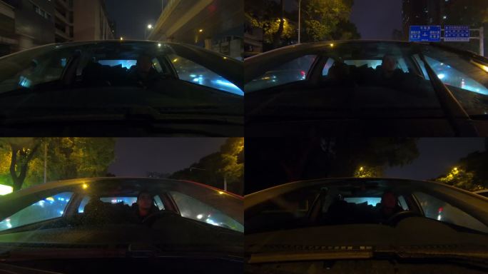 汽车行驶在夜晚的城市街头道路上正面向后拍