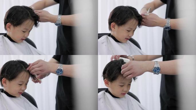 一名男子在理发店整理男孩头发的特写镜头。