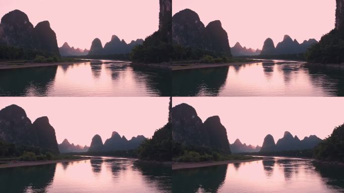 夏天落日映红了二十元人民币背景的山和漓江