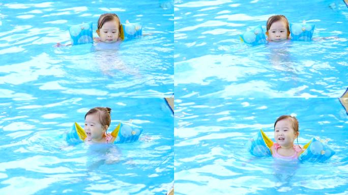 游泳池里的小女孩泳池嬉戏小孩陪伴