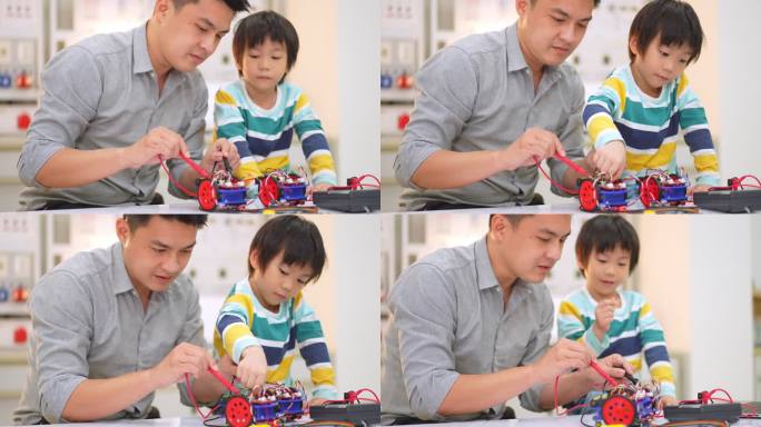 亚洲学生和教师在科学课上使用电子仪表和笔记本电脑构建自动驾驶机器人汽车的原型