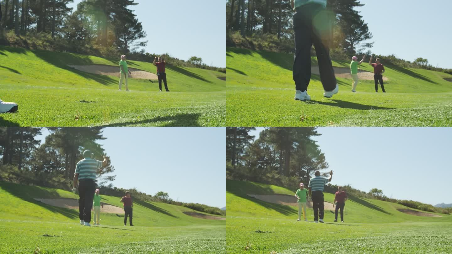 高尔夫球手在阳光充足的高尔夫球场上击球特写