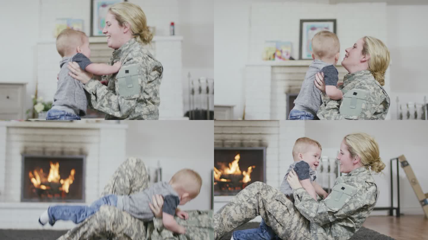 母亲士兵与她的宝贝玩耍