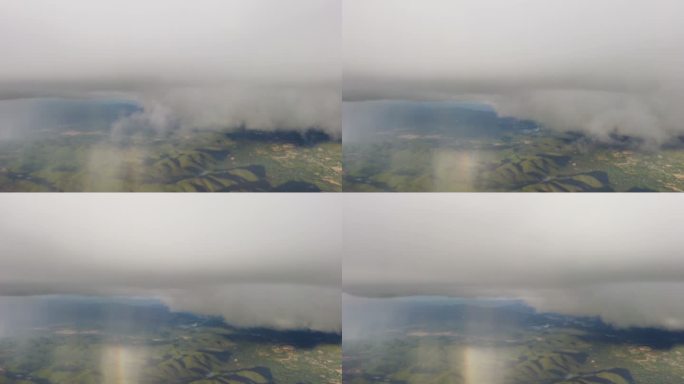 从飞机上的窗户望去，天空和雨滴的运动模糊