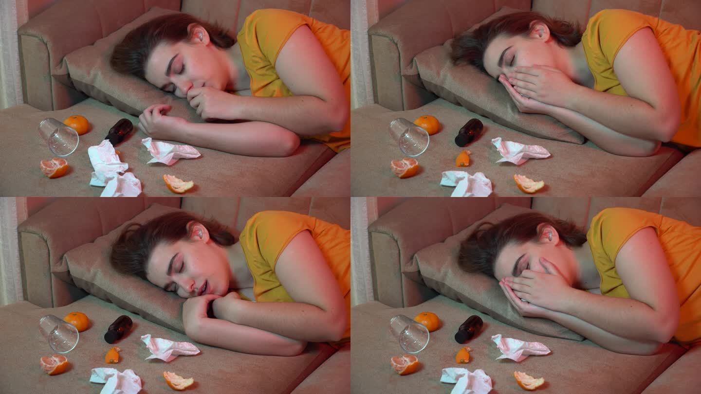 生病的女孩躺在沙发上，试图睡觉，咳嗽着用手捂住脸。4k分辨率视频。