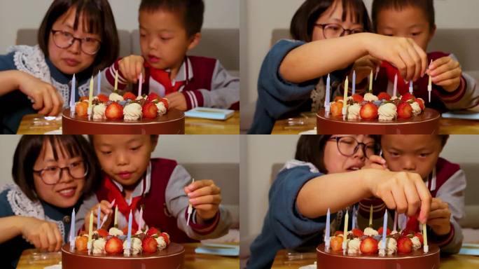 母子正在一起开心的把蜡烛插在生日蛋糕上