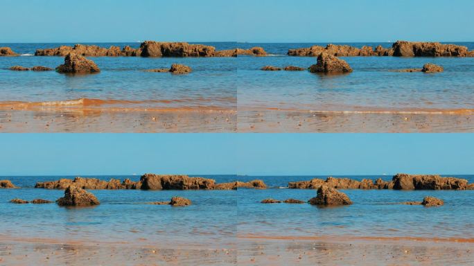 带岩石的海滩实拍浪花海边