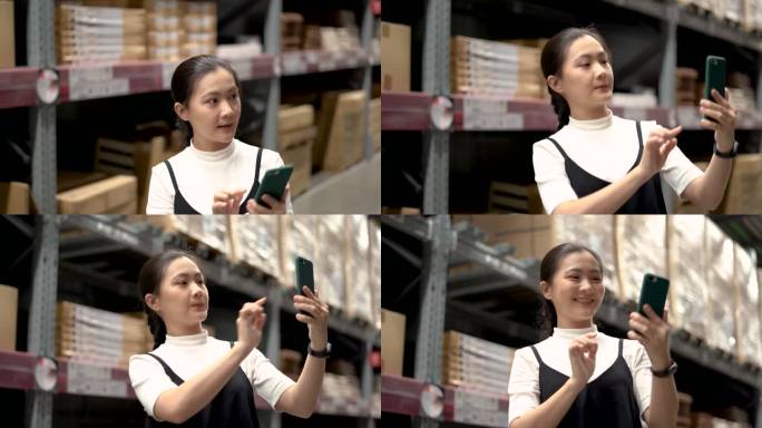 使用智能手机的亚洲女性在仓库里拍照或扫描二维码检查库存。