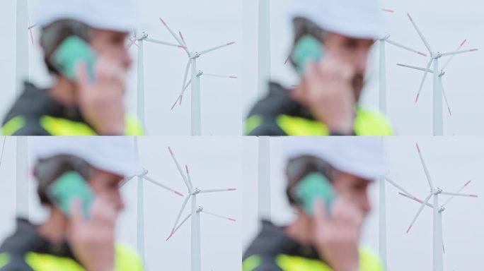 雨天在风力涡轮机农场工作的工程师。可再生能源系统。