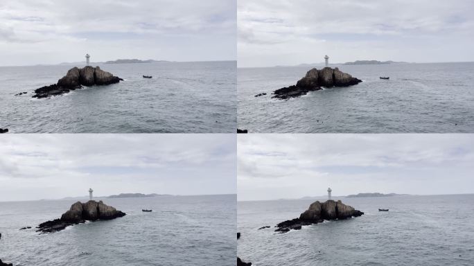 东极岛岸边礁石上的灯塔