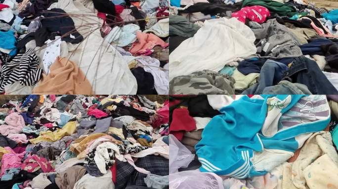 破旧衣服丢弃在野外的一堆旧衣服垃圾堆衣服