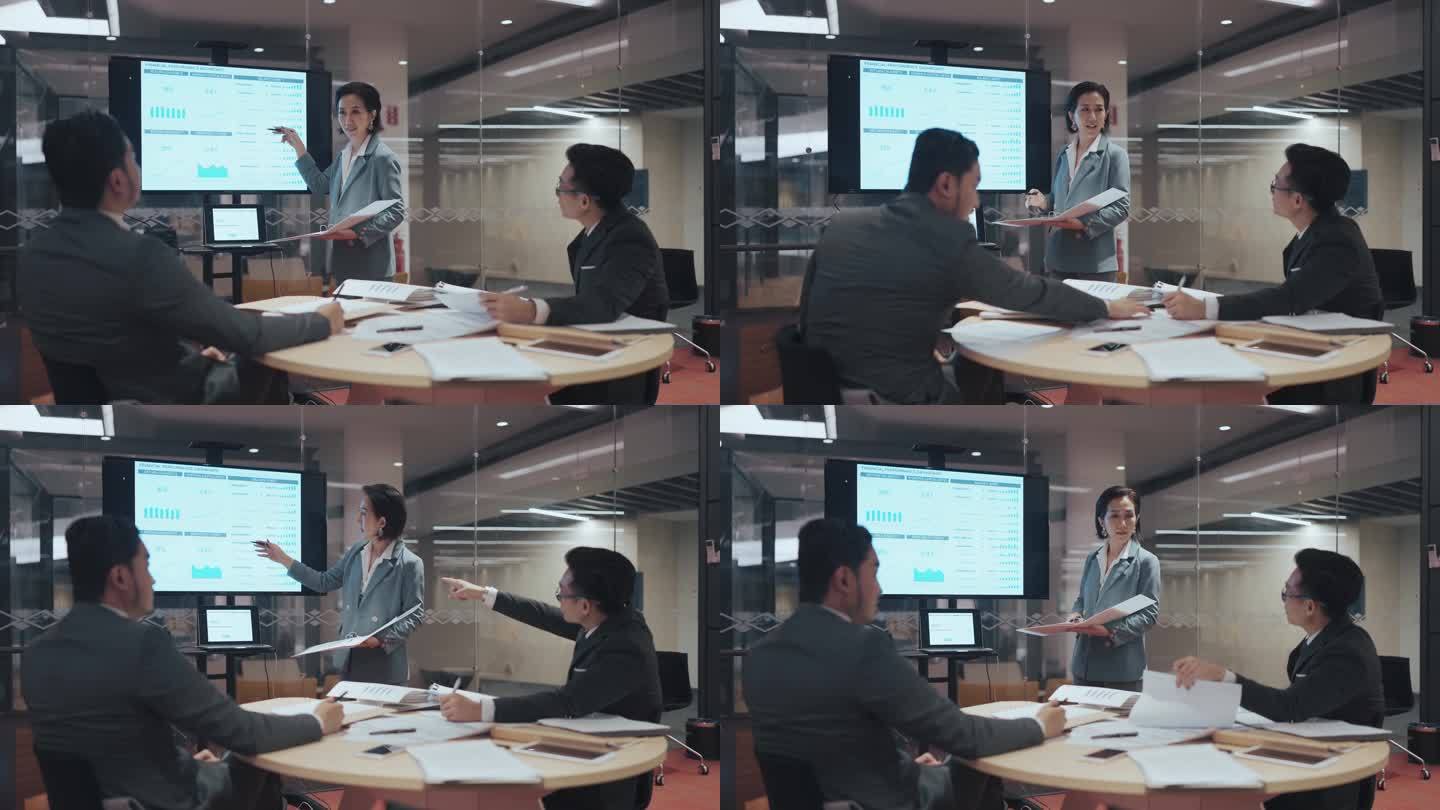 亚洲华人女经理在会议室与同事讨论新业务项目