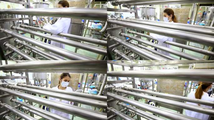 科学家在制药厂使用数字平板电脑。