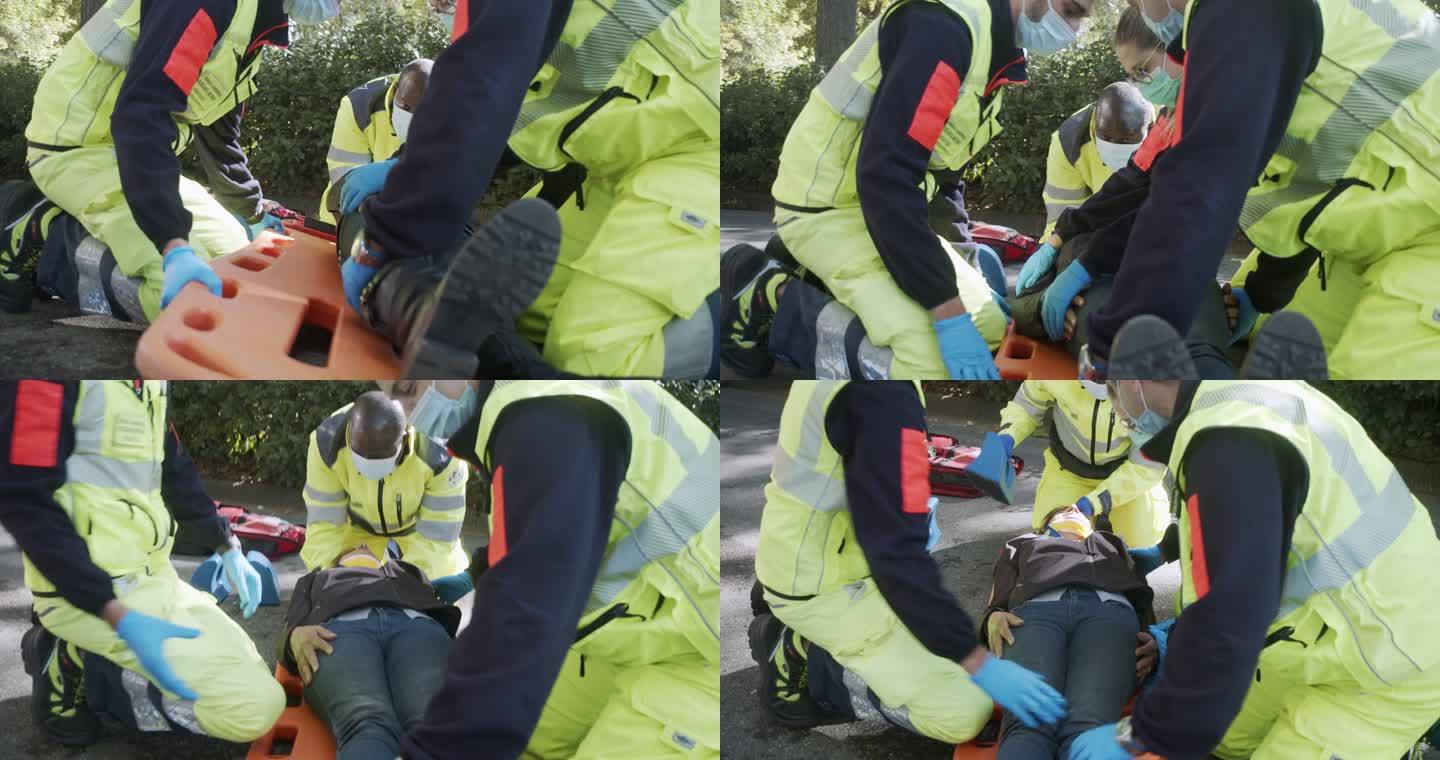 事故发生后，一名成年女子在救护人员的帮助下拍摄的慢镜头视频
