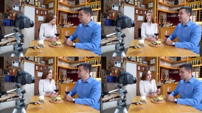 年轻的夫妇为他们的追随者拍摄了一段关于不同种类葡萄酒的视频