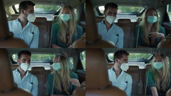 一男一女戴着防护面罩，坐在众包出租车的后座上，一边聊天一边享受骑行