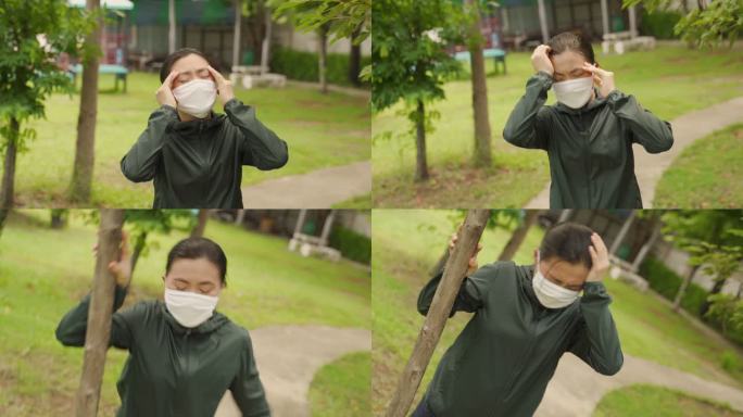 一名戴着防护面罩的亚洲女子在公园慢跑时头晕。