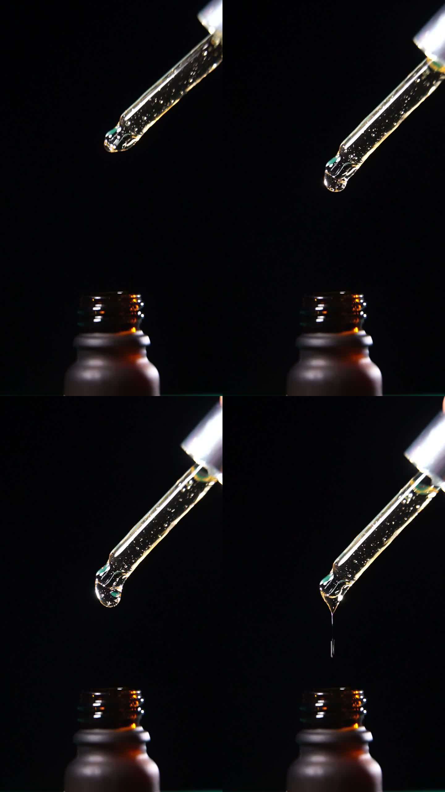 垂直拍摄：缓慢移动的液滴从移液管落入黑色背景的瓶子中，中心成分