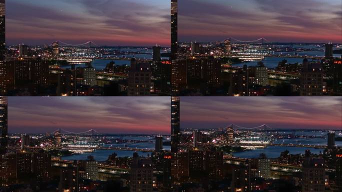 背景中的曼哈顿大桥、东河上的布鲁克林大桥和远处的维拉扎诺大桥。日落时分，纽约曼哈顿住宅区和项目的全景
