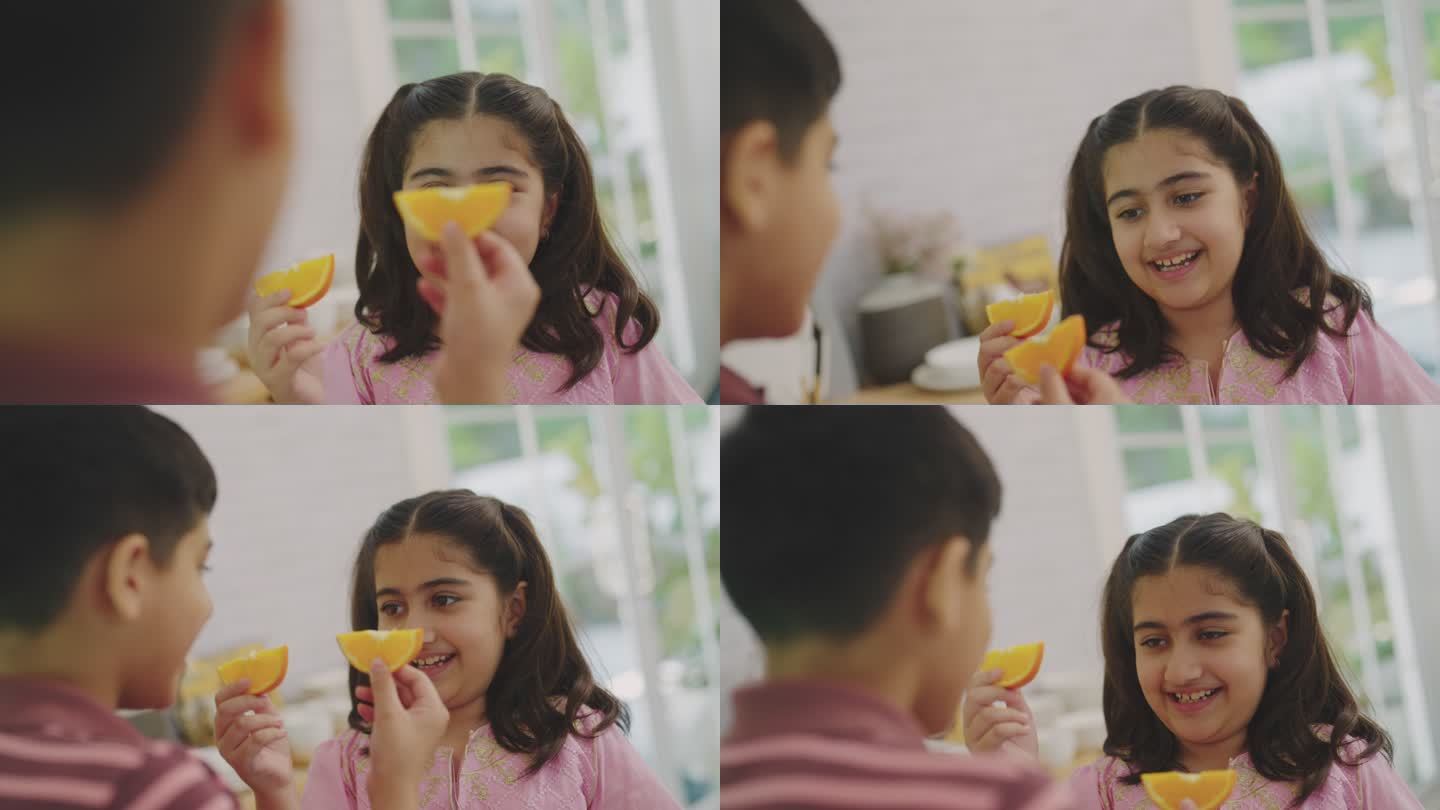 印度男孩吃他的橙子