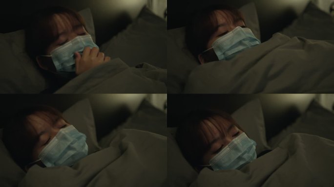 一名咳嗽和生病的妇女在床上戴着口罩