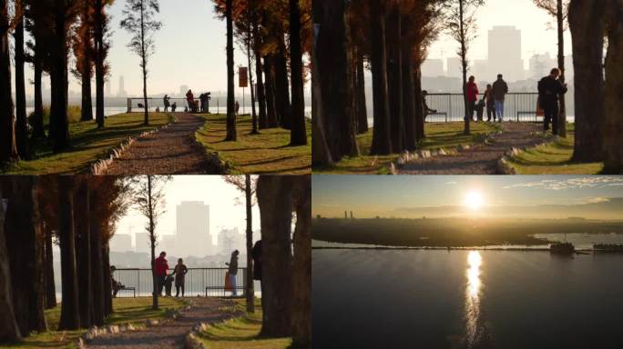 清晨滇池湖畔看日出的游客