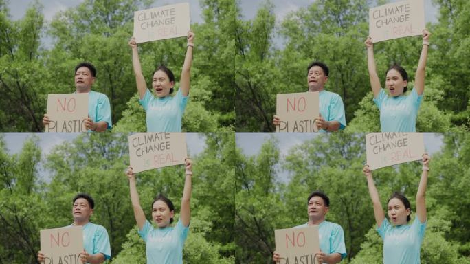 亚洲成年男性和成年女性志愿者为拯救我们的地球而奔走，向政府呼吁并抗议绿色环境、无全球变暖、无气候变化