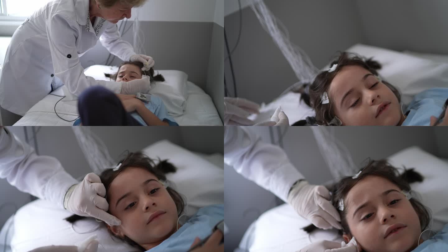 医生在多导睡眠图（睡眠研究）后移除儿童头部电极