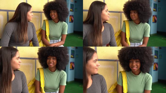 一个十几岁的女孩在学校和朋友聊天的照片
