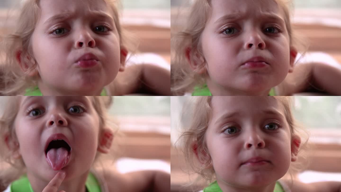 一个小女孩在镜头前皱着眉头的脸部特写