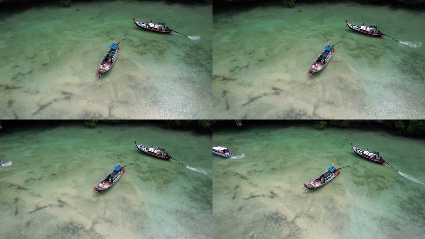 一名亚洲男子在旅游船上使用无人机拍摄度假视频